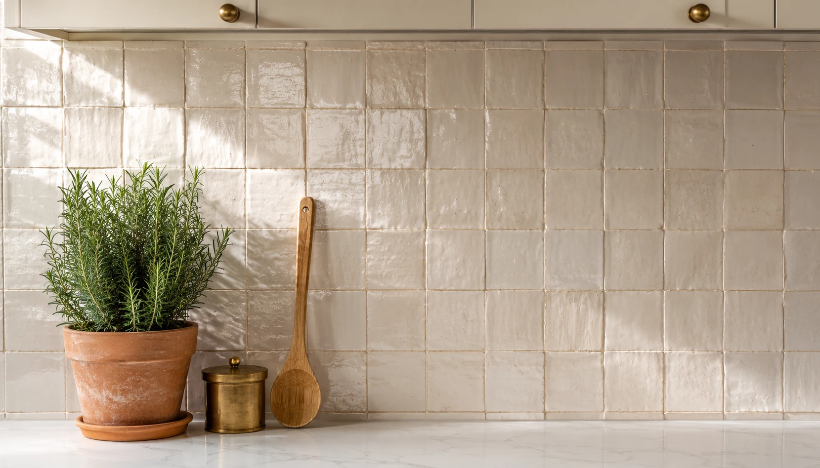 Small kitchen backsplash ideas 2026 showing beautiful tile feature wall in cream kitchen